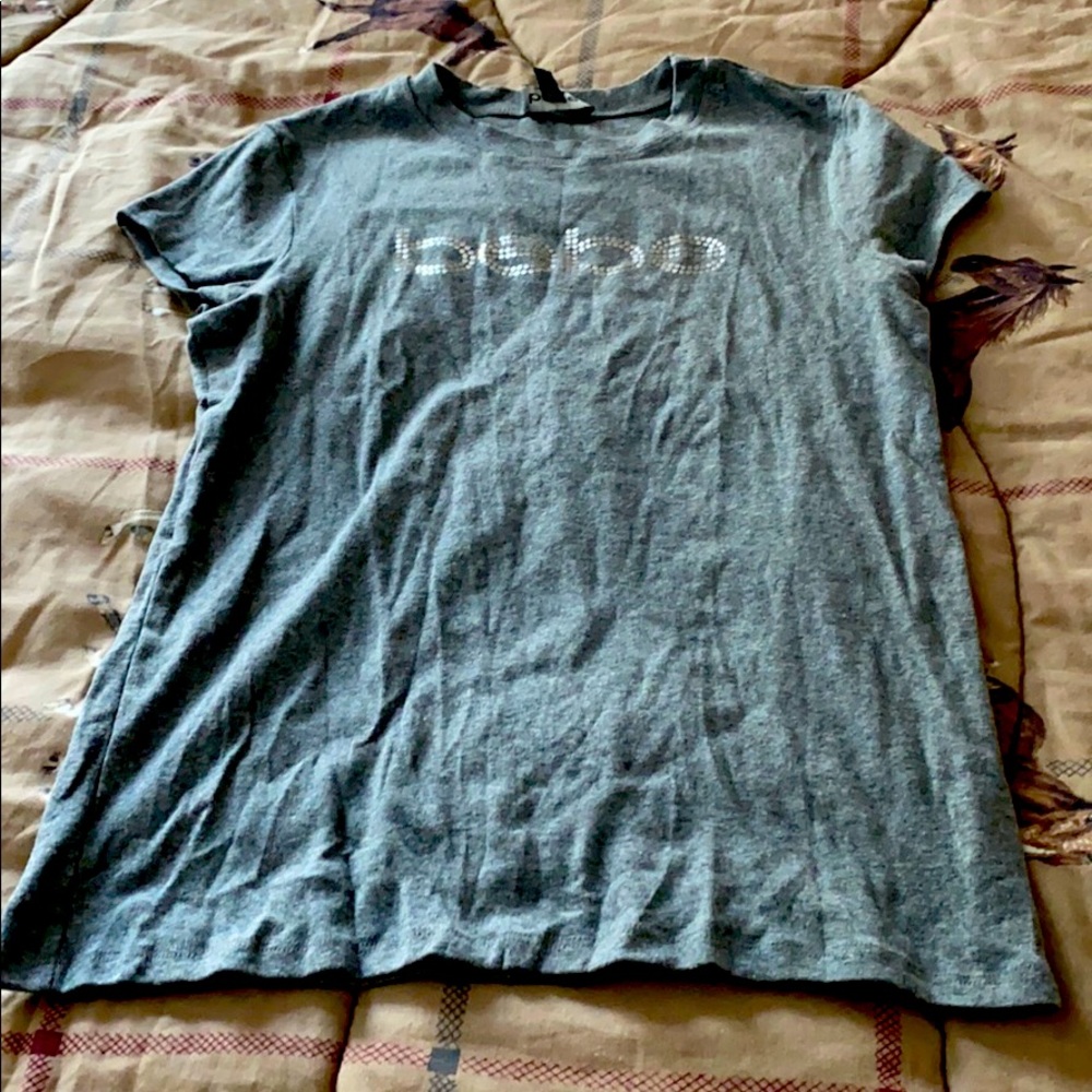 I am selling a Bebe T-shirt new condition.